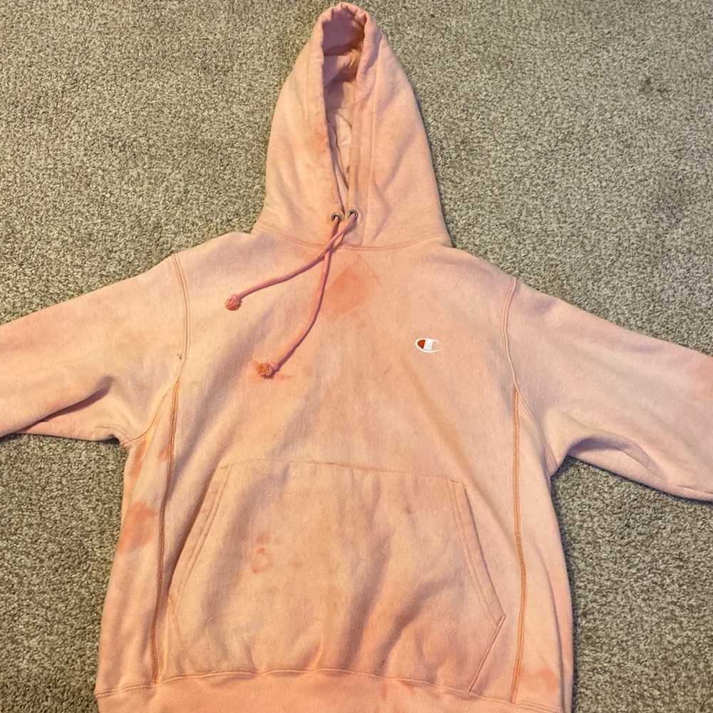 A coral pink large champion hoodie